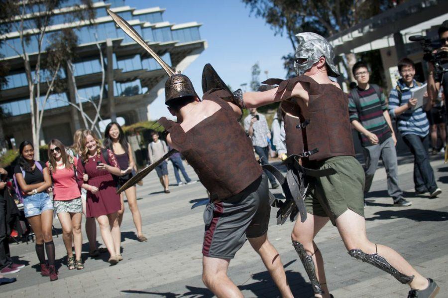 Members of UCSDs Mens Fencing team duel on Library Walk to promote upcoming Sony Pictures gladiator film Pompeii, which will hit theaters Feb. 21.