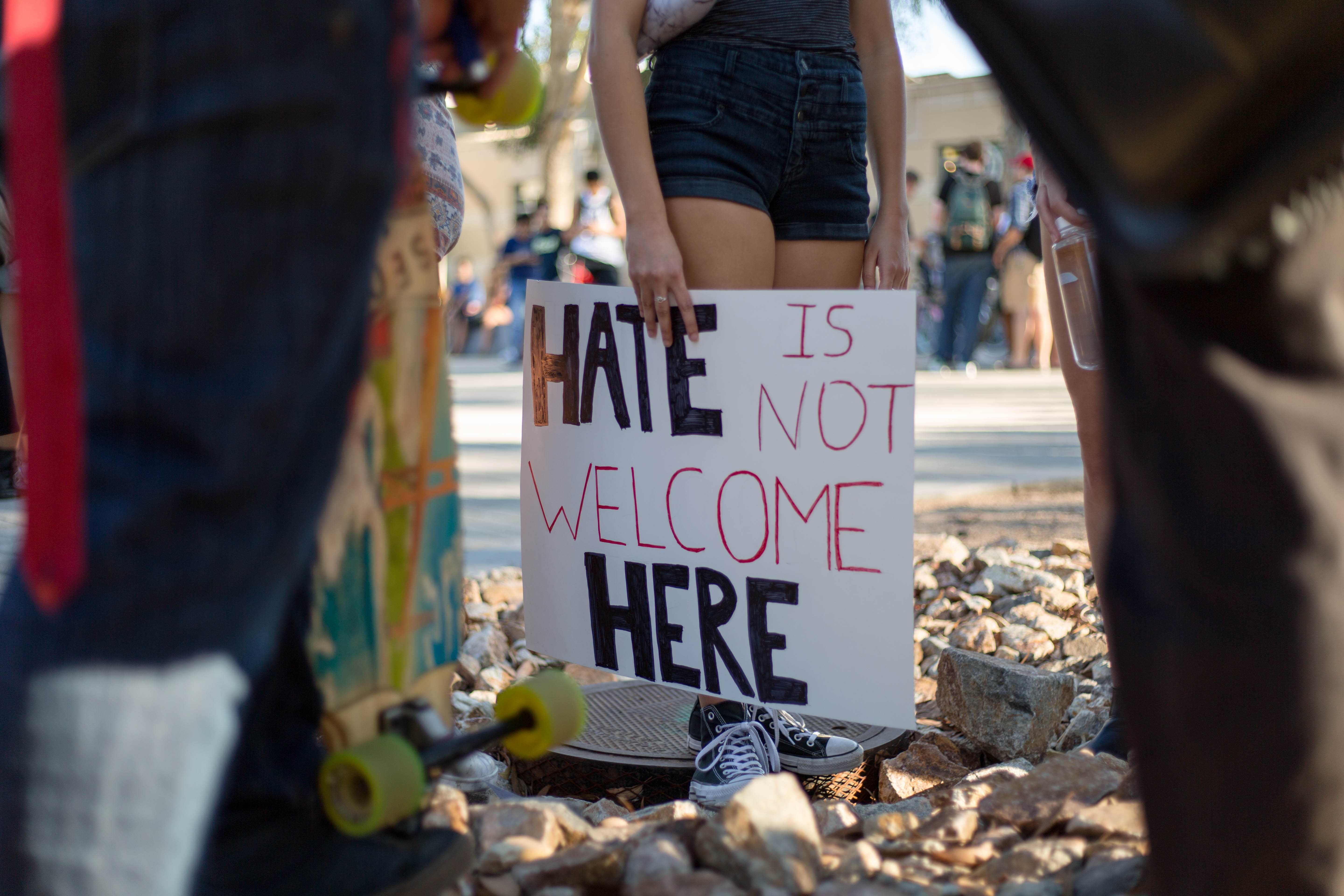 Student holds an anti-Trump sign at the Movement of Solidarity demonstration. 