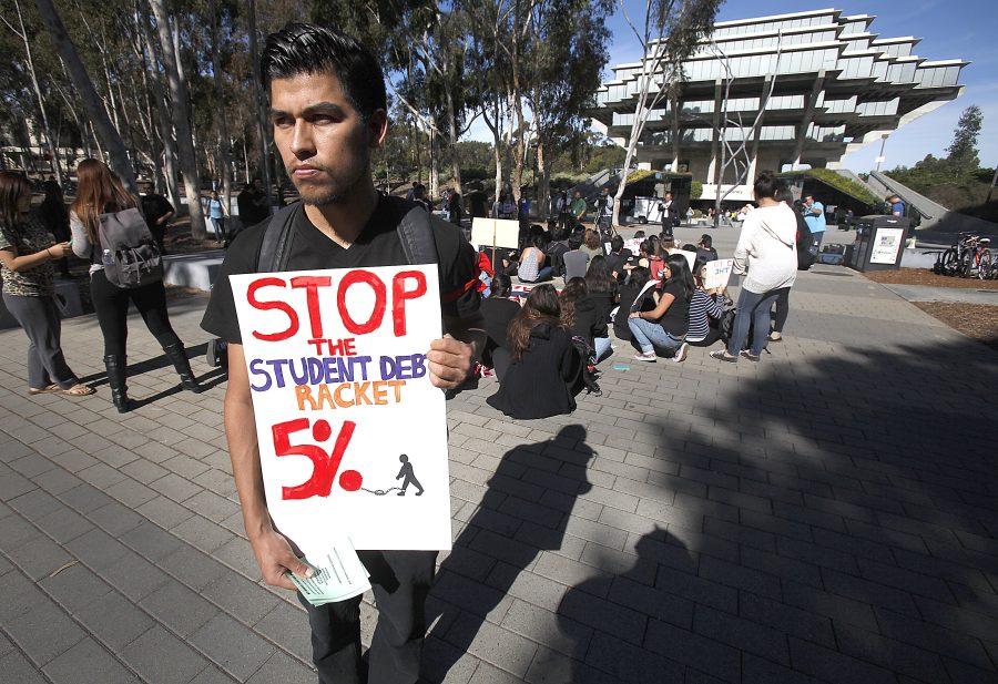 Student protesting 2014 tuition hikes. (Photo by John Gastaldo)