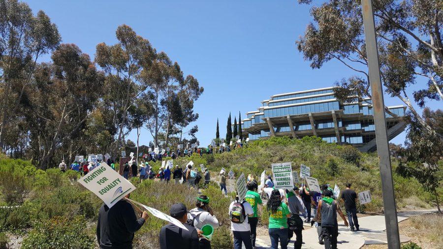 UC workers march up Snake Path next to Geisel as part of a demonstration while on strike in May 2018. Photo by Tyler Faurot // UCSD Guardian