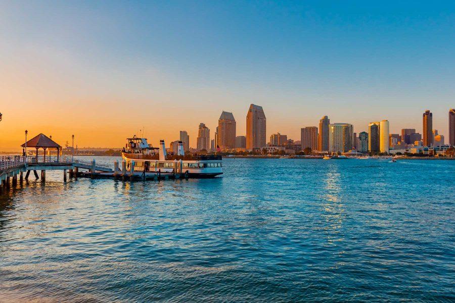 San Diego skyline is in the background with the ferry from Coronado Island docked at the wharf ready to leave for San Diego.